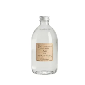 product photograph of Lothantique milk bath foam. It comes in a clear bottle with a screw top lid.