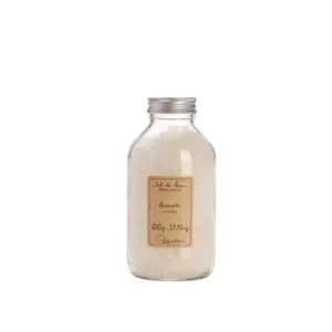 product photograph of Lothantique lavender bath salts. It comes in a clear bottle with a screw top lid.