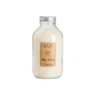 product photograph of Lothantique milk bath salts. It comes in a clear bottle with a screw top lid.