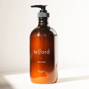 product photograph of Telford conditioner. It comes in a brown/ale coloured bottle with a pump dispenser.