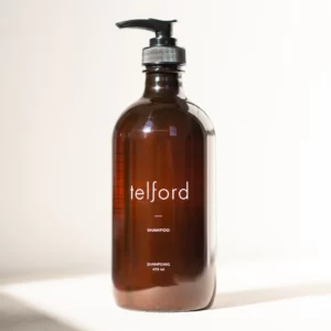 product photograph of Telford shampoo. It comes in a brown/ale coloured bottle with a pump dispenser.